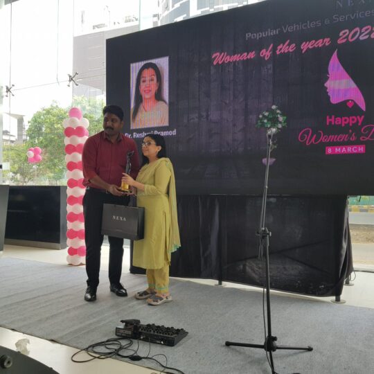 On Women's Day 2022, Dr Reshmi Pramod being honoured by Maruti Suzuki Nexa Kochi
