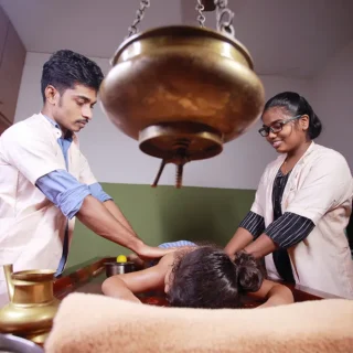  Abyangam, a type of Ayurvedic therapy for autism, where warm herbal oil is applied to the child's body using gentle, rhythmic strokes to promote relaxation, improve circulation, and enhance overall well-being