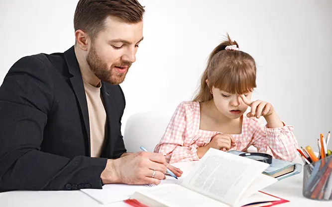 girl-with-down-syndrome-studying-with-her-teacher-home.webp