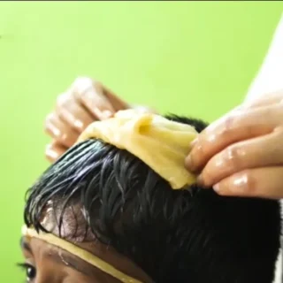  Siro Pichu, an Ayurvedic therapy for autism, where a cotton swab dipped in medicated oil is placed on the child's scalp after a head massage to provide therapeutic benefits